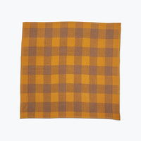 Large scale gingham plaid in ochre yellow and tan.
