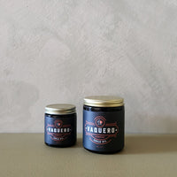 2 jars that say Vaquero on the label on a grey background.