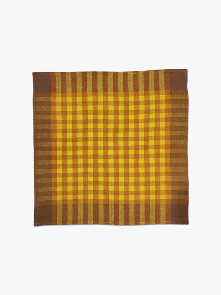 Plaid fabric with yellow and brown colors on a white background