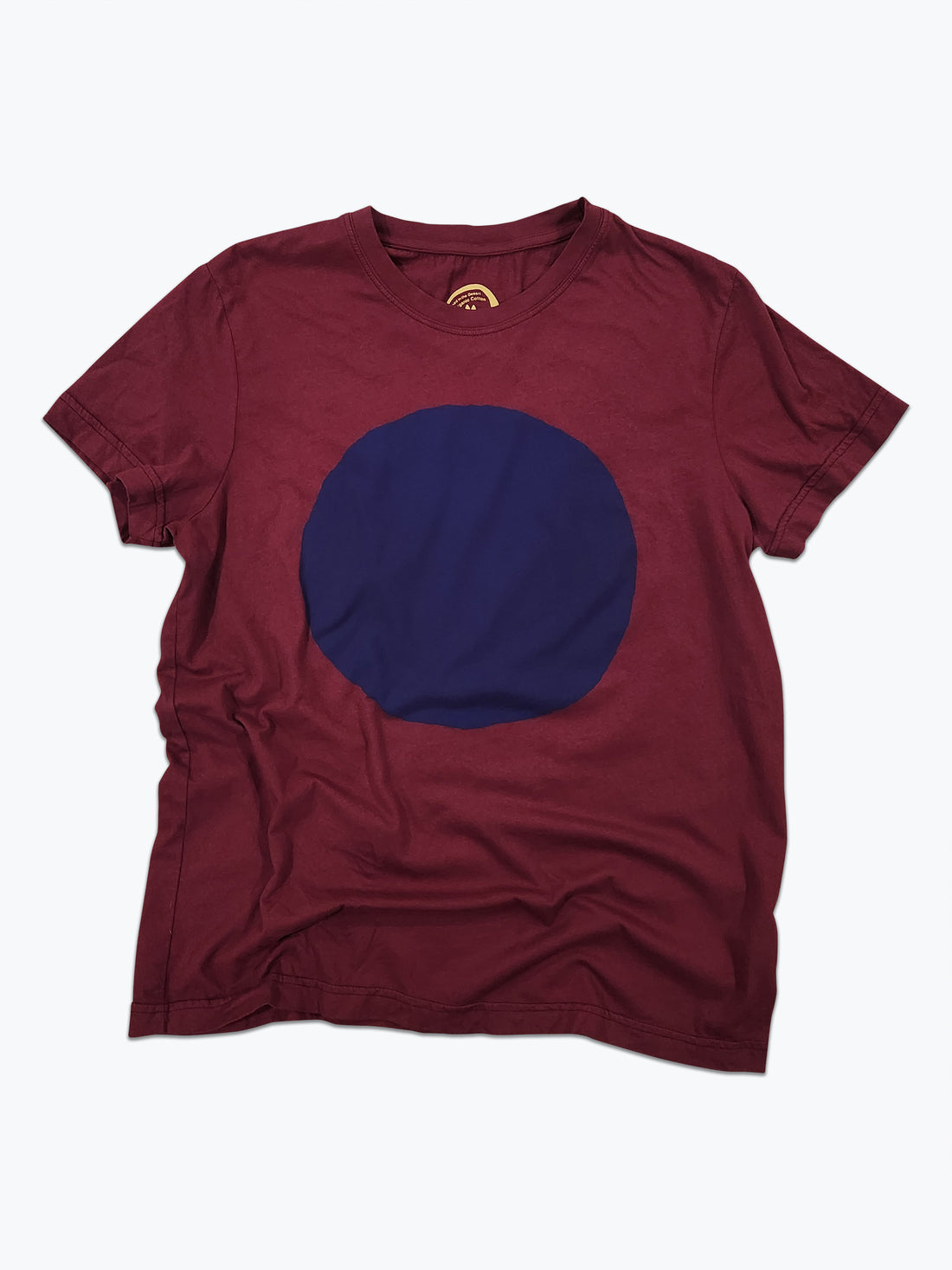 Maroon t-shirt with a large blue circle on a white background
