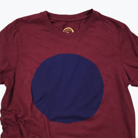 Maroon t-shirt with a large blue circle on a white background